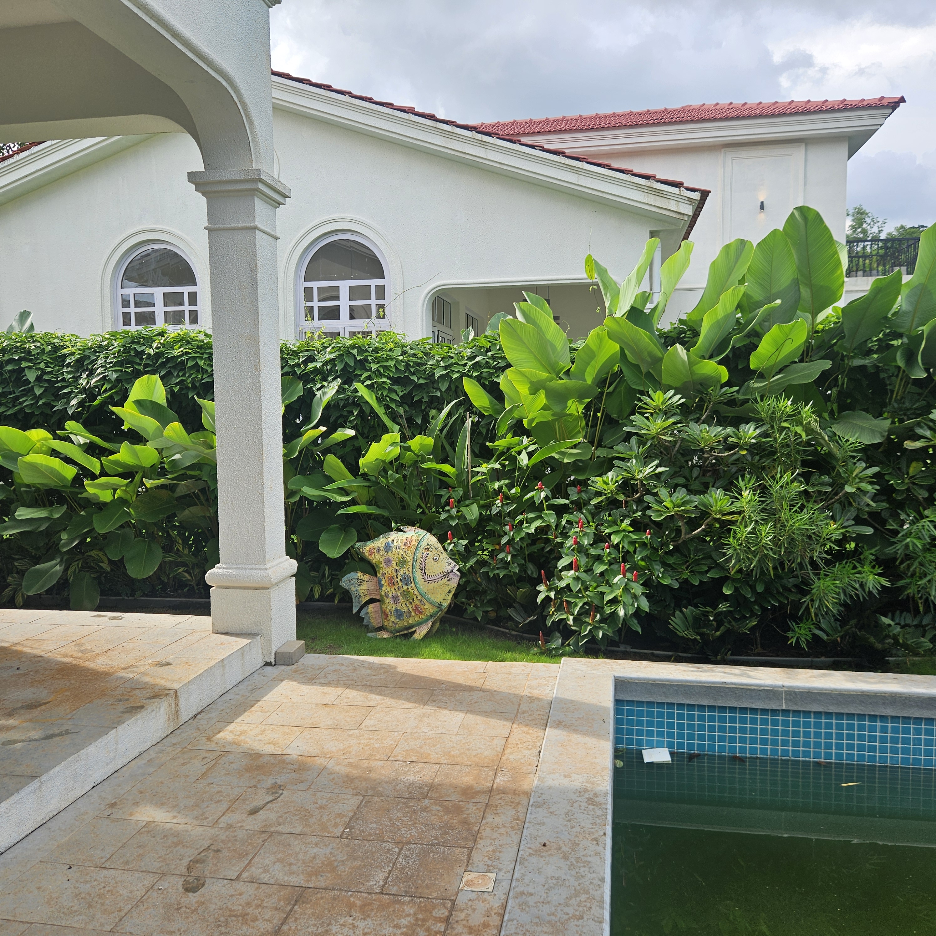 Tropical landscape design at Siolim Isprava villa with curated garden elements